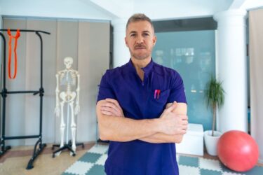 male-healthcare-worker-standing
